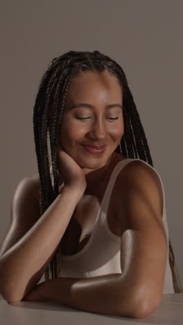 studio portrait shot of young woman feeling softness of skin after using beauty product 3