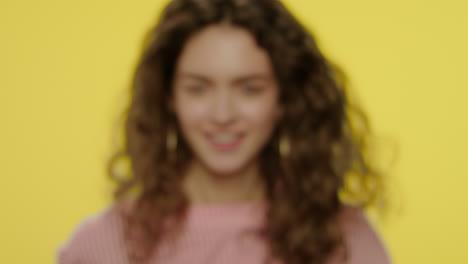 cheerful woman shooting from yellow banana in air and temple like weapon