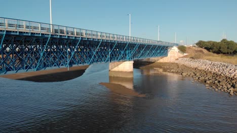 Aerial-backward-low-shot-of-Portimao-blue-car-bridge-full-of-details,-close-up