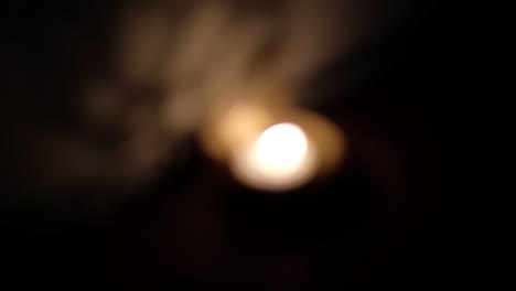 defocus bokeh shadow and light dance, play reflection on wall of ganesha cutout, also ganapati vinayaka, one of the best-known and most worshipped deities in the hindu pantheon, during diwali