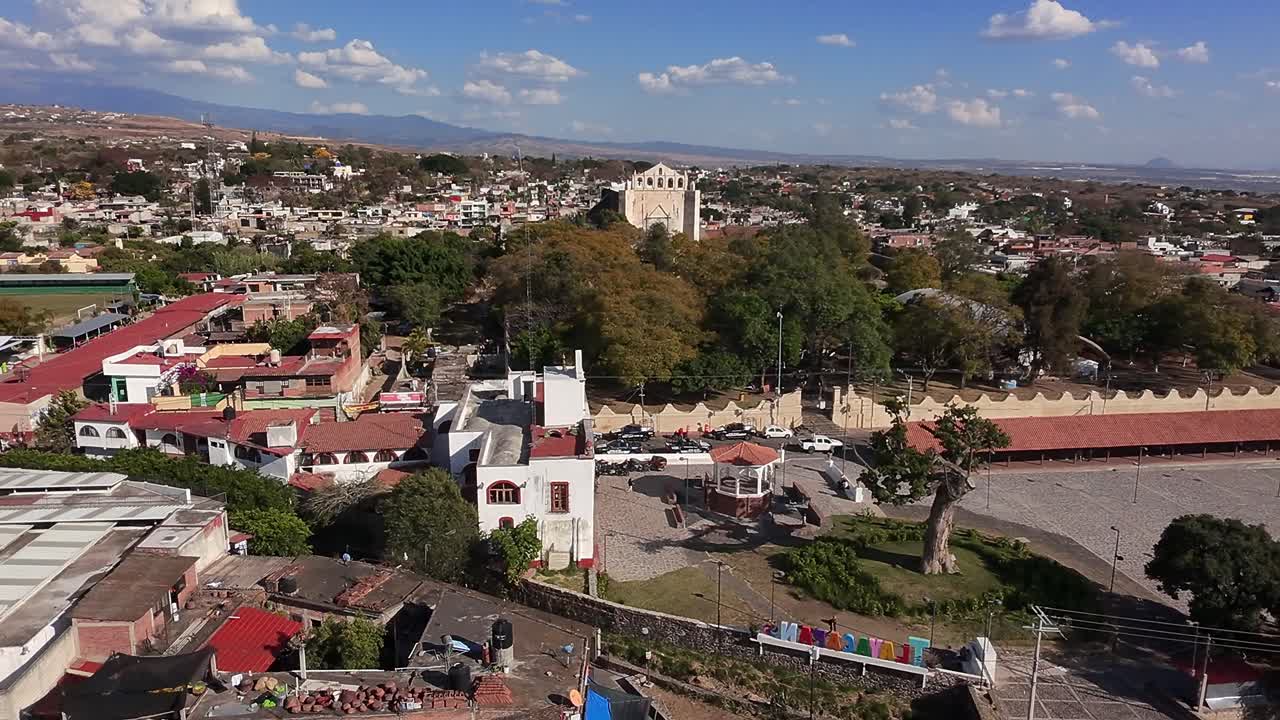 Historic town center with trees and church in Oaxtepec and Tlayacapan, Morelos