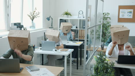 funny office workers with paper bag heads