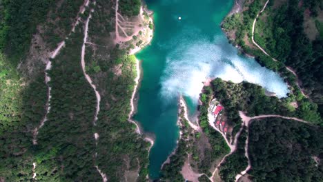 aerial bird-eye view flying above lake tsivlou in the mountains of peloponnese in greece