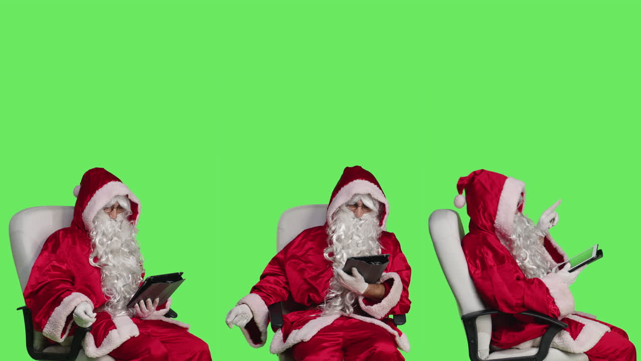 Santa Claus using tablets on green screen