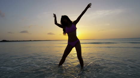 happy asian chinese female in bikini on beach