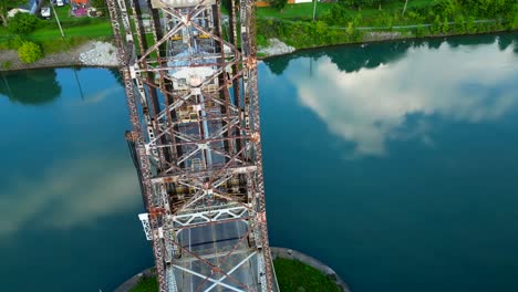 aerial drone circle around lake lift bridge top notch water architecture tower