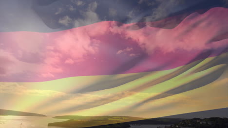 german flag animation over scenic landscape with clouds and sunset