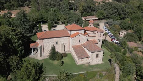 orbital flight part two with drone in the majestic sanctuary of the virgin of chilla, 16th century, we see its rear structure and its variety of roofs, it is surrounded by gardens, it is fascinating