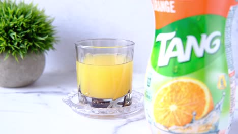 tang orange juice in a glass