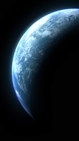 vertical format : a cinematic rendering of planet earth during sunrise as view from space with vibrant blue sky atmosphere