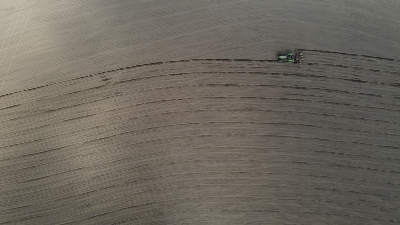 Farming season starting and the farmers preparing their corn fields. Ploughing scene