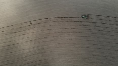 farming season starting and the farmers preparing their corn fields. ploughing scene