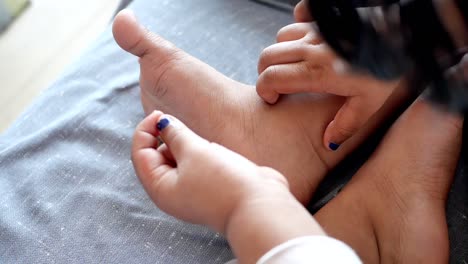 child caring for feet