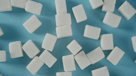 sugar cubes on the table. on a blue background.