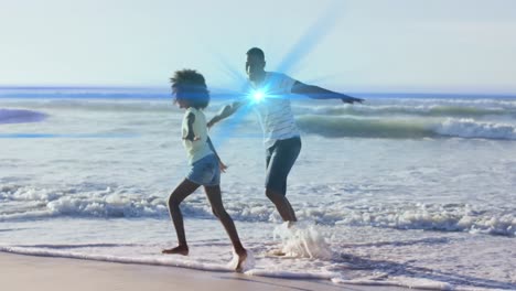 Animation-Von-Lichtspuren-über-Einem-Afroamerikanischen-Mann-Und-Seiner-Tochter-Am-Strand