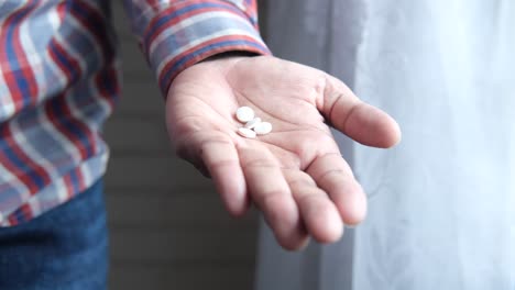 hand holding pills