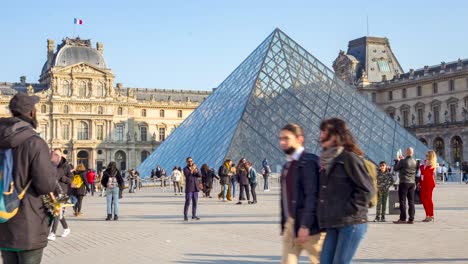 timelapse of visitors and tourists on the grounds of the louvre museum. it is the world’s most-visited art museum, with a collection that spans work from ancient civilizations to the mid-19th century.