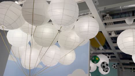 hanging paper lanterns with cloud backdrop