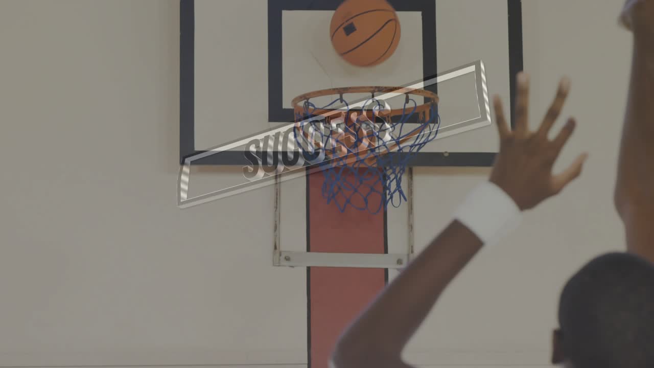 Man raising ball and shooting in sports gym, SUCCESS graphic sweeping as arms reaching, scoring