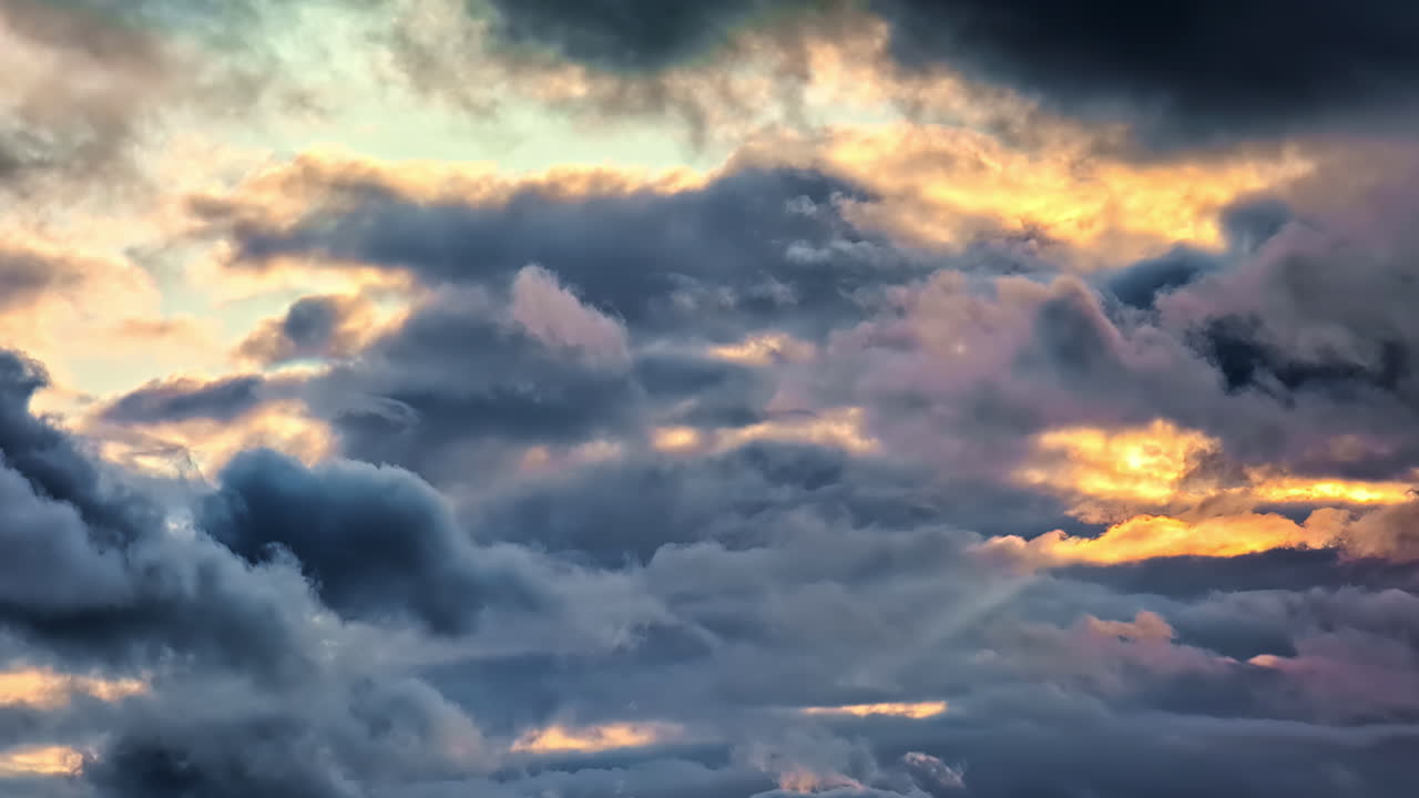 Dark Clouds Illuminated By Sunset Backlit. Slow Motion