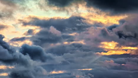 dark clouds illuminated by sunset backlit. slow motion