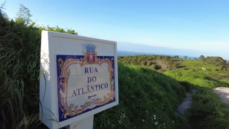 rua do atlantico road sign near cabo da roca panning shot in winter