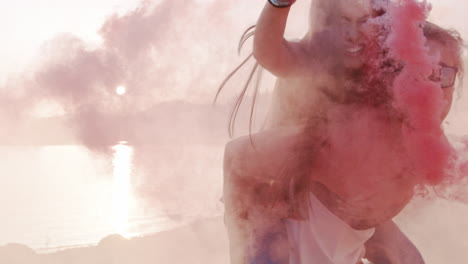 pink smoke beach fun piggyback rides