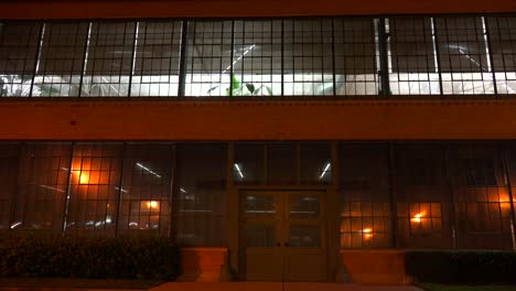 lights glow inside a warehouse or factory at night 2