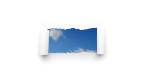 creative 4k time laps video of fast moving clouds in the blue sky that are visible through a hole with torn edges in white paper. the concept of opportunities, a happy future.