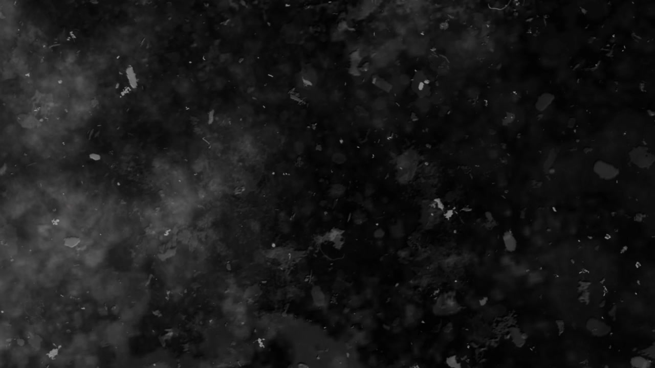 Textura grunge abstracta negra con partículas de polvo flotantes