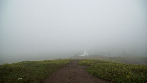 panning from right to left showing a foggy town in lomas de manzano, pachacamac, lima, peru