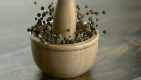 Mixed-peppercorns-in-a-super-slow-motion.-Dry-mix-peppercorns-close-up.