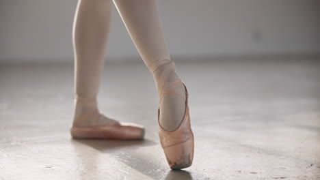 ballerina, pointe shoes and stretching feet