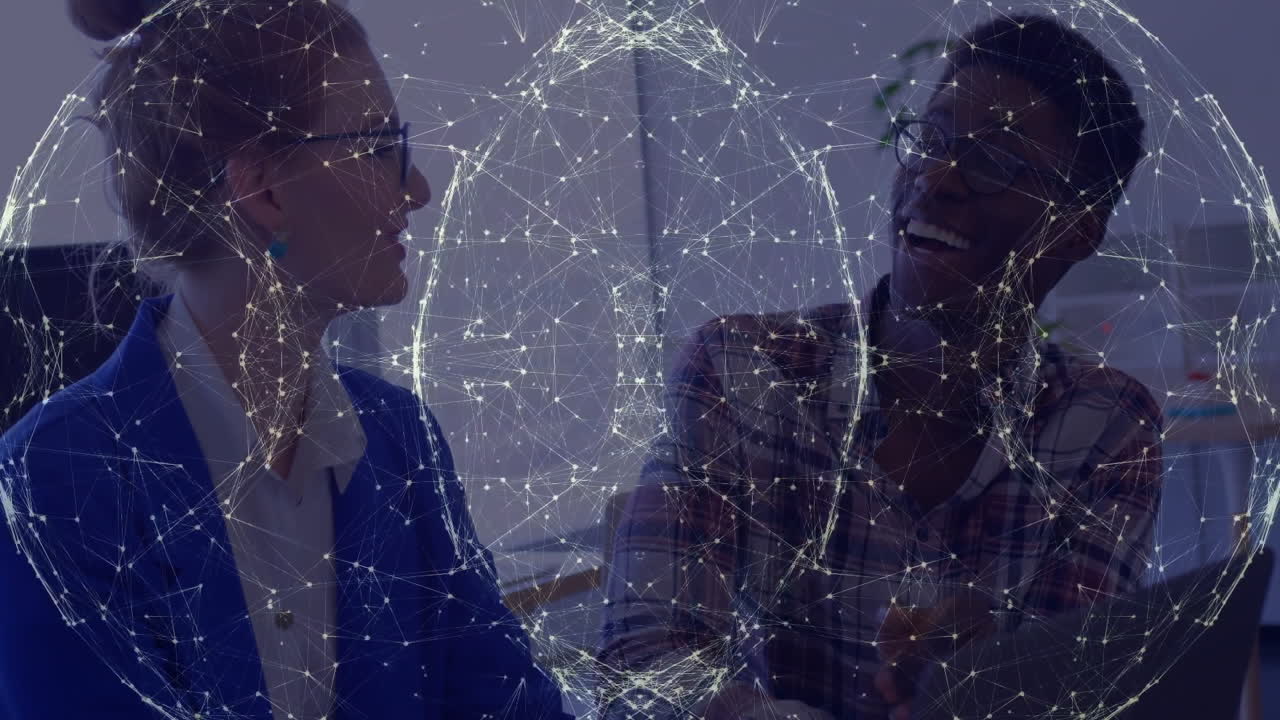 woman and man discussing marketing data on laptop in office, featuring animated globe overlay