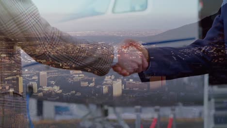 Handshake-with-city-in-background