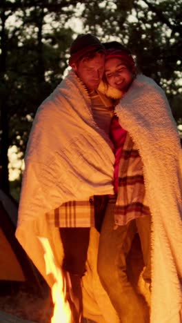 couple enjoying a campfire