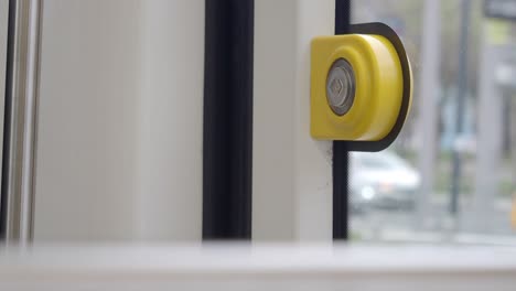 yellow door handle on a train door