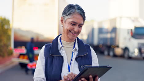woman using tablet near trucks