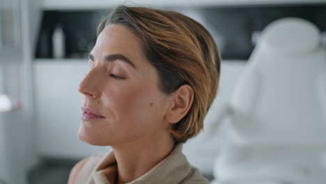 Doctor-making-facial-examination-woman-closeup.-Beautician-hands-touching-face.