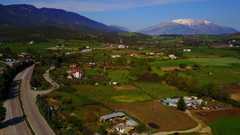 scenic aerial views over greece landscape with mount parnassus in the background near livadias