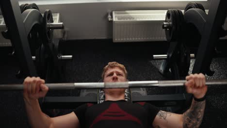 man lifting weights in the gym
