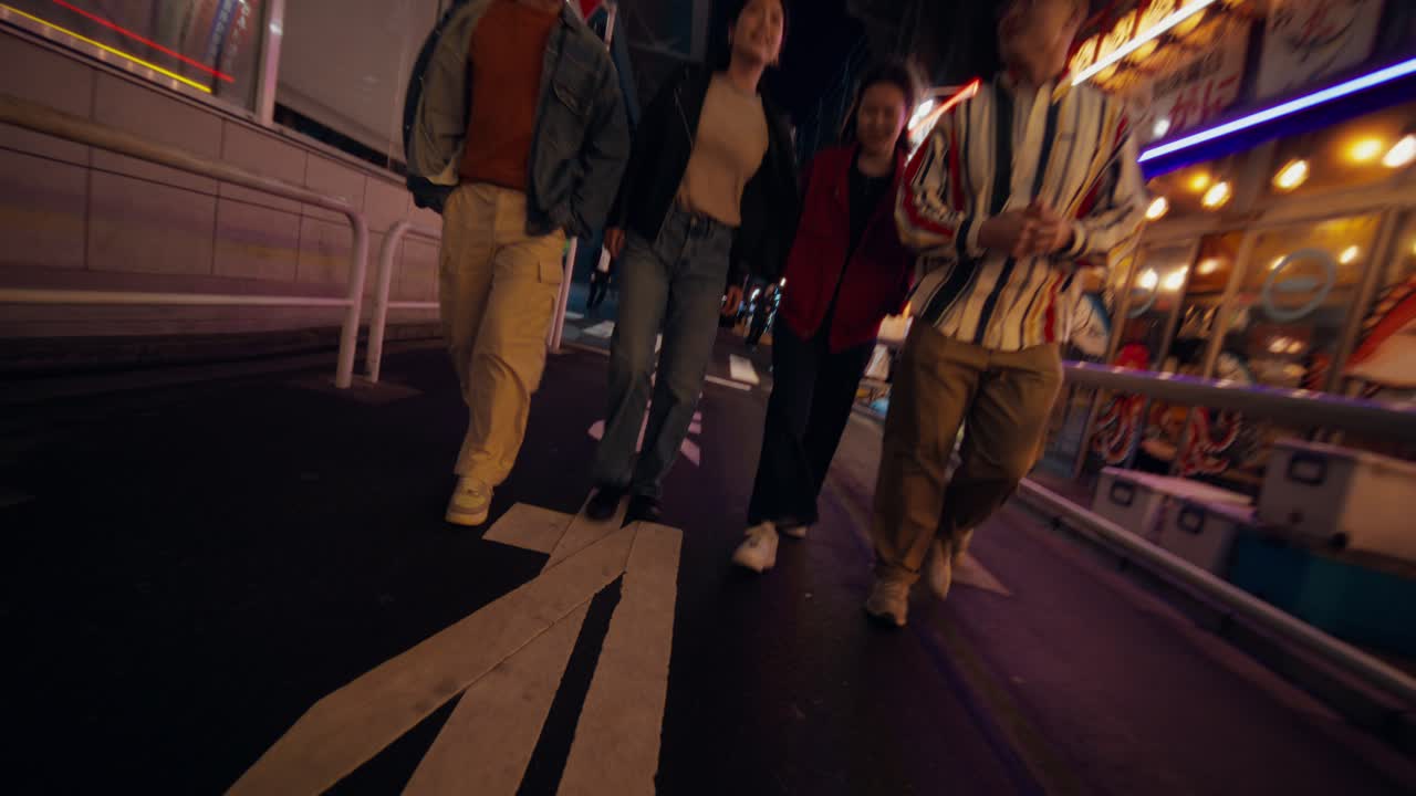 Friends Walking in a Night Street of Japan