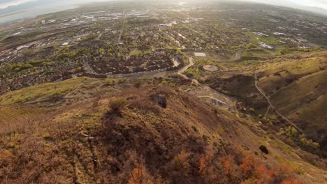 Gazing-out-from-the-wasatch-mountaintop,-your-eyes-are-treated-to-a-sweeping-landscape-of-rolling-hills,-verdant-utah-valley,-and-soaring-peaks-that-seems-to-stretch-on-forever