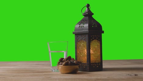 A-Tracking-Shot-of-Lantern-Dates-and-Water-In-Front-of-a-Green-Screen