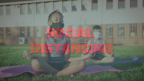 social distancing text against school boy and girl wearing face mask practicing yoga at school