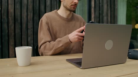 man working from home, outdoor patio