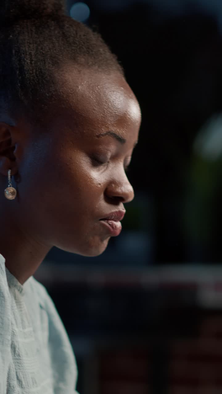 Close-up of a contemplative black woman