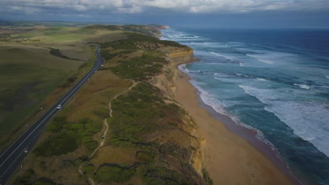 Car-Driving-Australia-Twelve-Apostles-Drone-Great-Ocean-Road-Melbourne-cinematic-pan-ocean-scape-with-beautiful-stunning-sunset-by-Taylor-Brant-Film