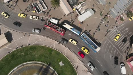 aerial perspective on a roundabout with a big fountain in the middle in the city center of athens