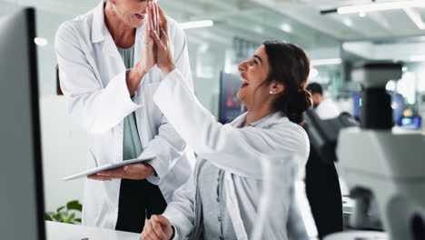 scientists celebrating success in the laboratory